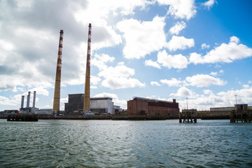 The Poolbeg chimneys viewed from a boat in Dublin bay, Dublin, Ireland
