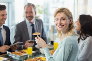 Woman holding a cup of coffee
