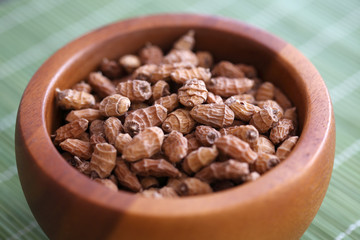 Tiger nuts in the wooden bowl