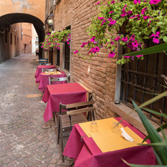 Old pub in a tiny alley in the city center of Ferrara Italy
