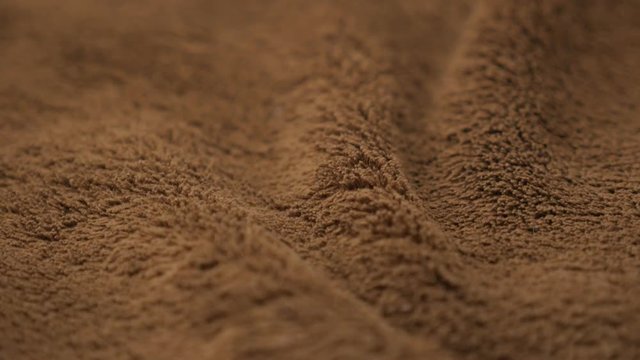 Shallow DOF polar blanket close-up 4K 2160p UHD footage - Brown polar blanket texture slow tilt 4K 3840X2160 UHD video 