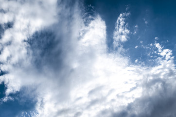 Streams cumulus clouds are mixed from the wind with cirrus clouds

