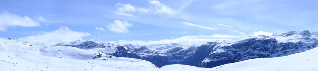 Fototapeta na wymiar Panorama of snow-capped mountains