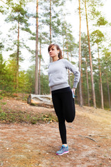 Young woman run in autumn the forest sunset lights