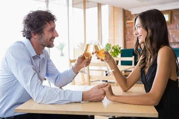 Couple toasting glasses of champagne