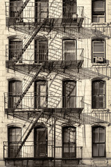 Typical old New York City building with fire escape ladders (antique look processed)