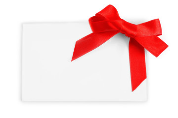 Note card with ribbon bow on white background