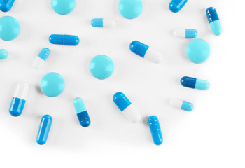 Blue pills on white background