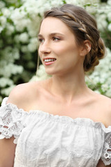 Young beautiful bride in the garden