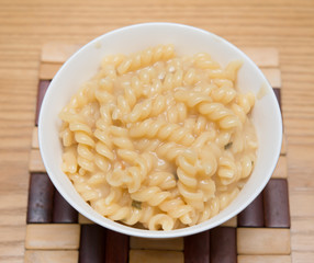 fresh pasta with cheese sauce in a bowl