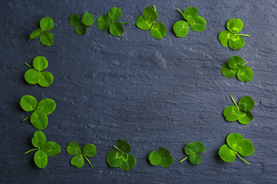 Frame Of Clover Leaves On Dark Background