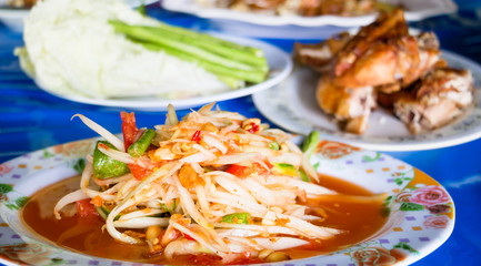 spicy papaya salad on table