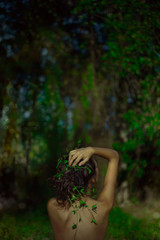sensual portrait of young beautiful woman with jungle background