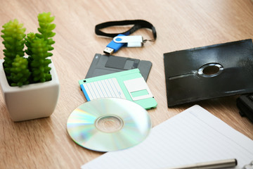 desk with note ,floppy disk A, floppy disk B and memory drive in home office, private office and modern desk in modern life, online market and planning for work, document and paper on desk.