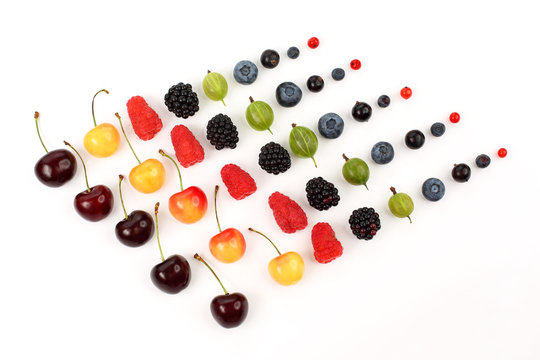 many different juicy berries are arranged in order 
