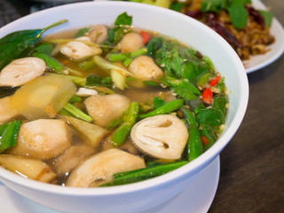 traditional thai spicy soup with pork and mushrooms © Kwangmoozaa