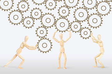 Concept of hard teamwork. Abstract image with wooden puppets