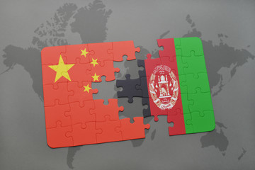 puzzle with the national flag of china and afghanistan on a world map background.