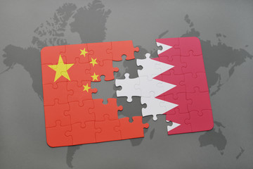 puzzle with the national flag of china and bahrain on a world map background.
