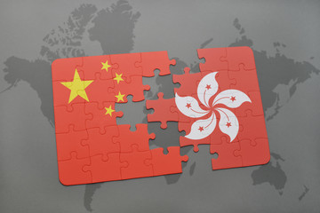 puzzle with the national flag of china and hong kong on a world map background.