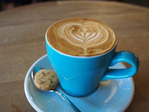 Hot Piccolo Latte With A Small Biscuit