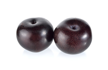 ripe black plum on white background