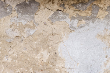 old house wall with cracked plaster