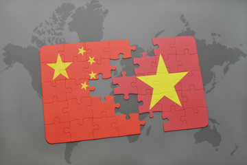 puzzle with the national flag of china and vietnam on a world map background.