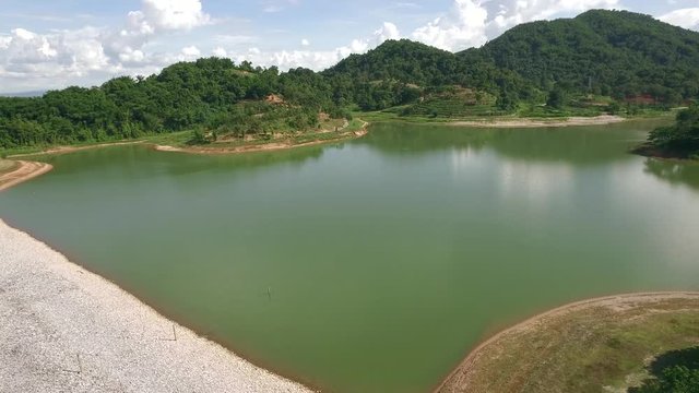 Aerial shot of big reservoir inside public university of Thailand