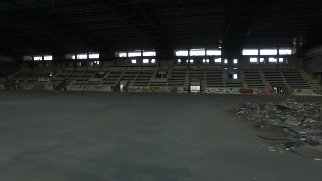 Flight Into Abandoned Ice Arena And Tribune