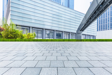 empty pavement and modern buildings in city