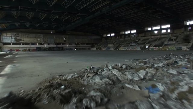 Flight Into Abandoned Ice Arena And Tribune