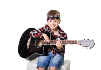 boy sitting and playing with guitar  isolated on white backgroun