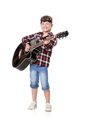 Naklejka premium boy stands and plays the guitar isolated on white background
