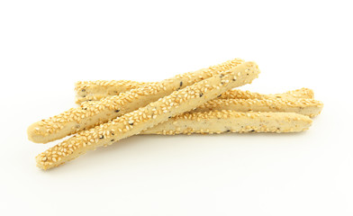 crispy sticks with sesame on white background