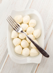 overhead mozzarella cheese balls in white porcelain