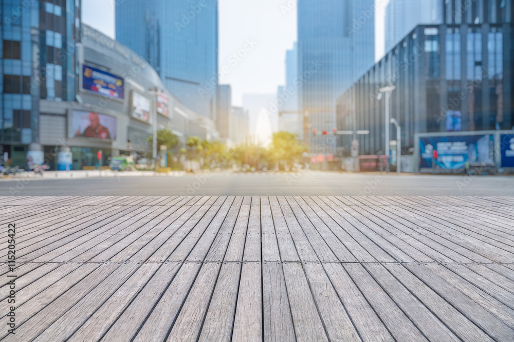 Wall mural empty wooden floor with modern building in city