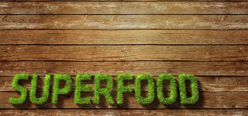 Superfood made of grass on wood background