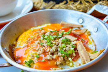 Pan fried egg with topping,Indochina Omelette breakfast.