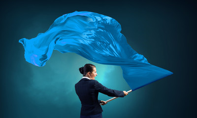 Woman waving blue flag . Mixed media
