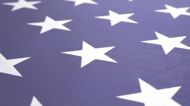 American flag close up fabric filmed with dolly 4K UHD 2160P footage - American flag stars and fabric slow moving dolly 4K 3840X2160 UHD video 
