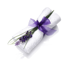 Fototapeta na wymiar Spa towel with flower and ribbon