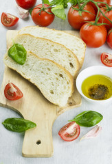 Fototapeta na wymiar Italian food: ciabatta, basil, tomatoes, garlic, pepper, olive o