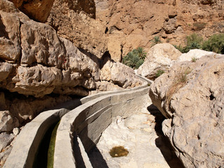 Falaj - irrigation channel in Wadi Shab, Ash Sharqiyah region, Sultanate of Oman