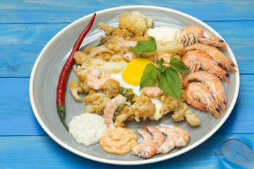 coliflor con mariscos, verduras con mariscos