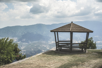 Wooden gazebo high in the mountains