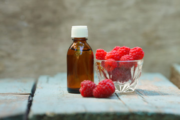 Red Raspberry Oil container with red raspberry