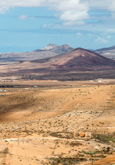 Fototapeta na wymiar Landscape of fields and mountains near Antigua village, Fuerteventura, Canary Islands, Spain