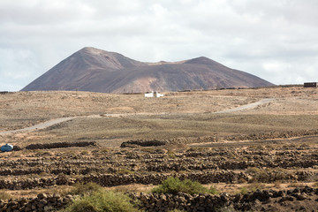 Obraz na płótnie Canvas Landscape of fields and mountains near Antigua village, Fuerteventura, Canary Islands, Spain