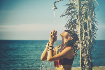 Attractive fashionable woman having fun on the beach.

